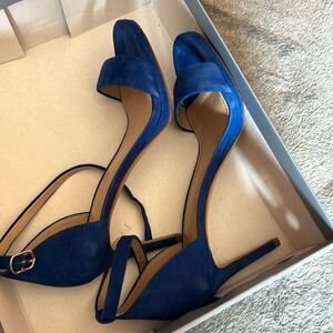 Blue suede high heel sandals.